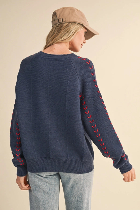 Ivory Sweater with Red Stitching