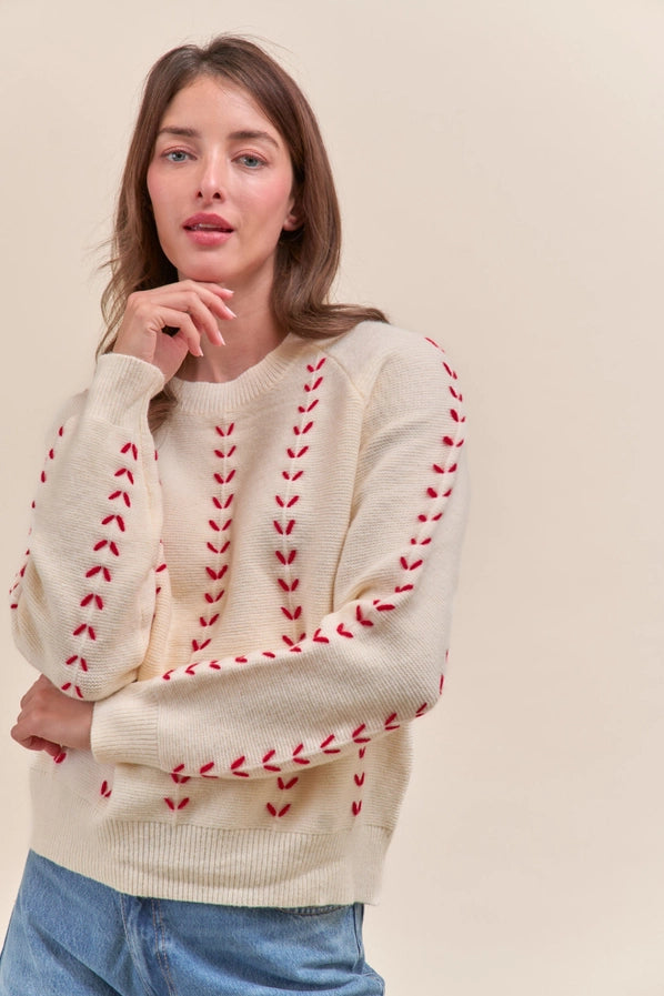 Ivory Sweater with Red Stitching